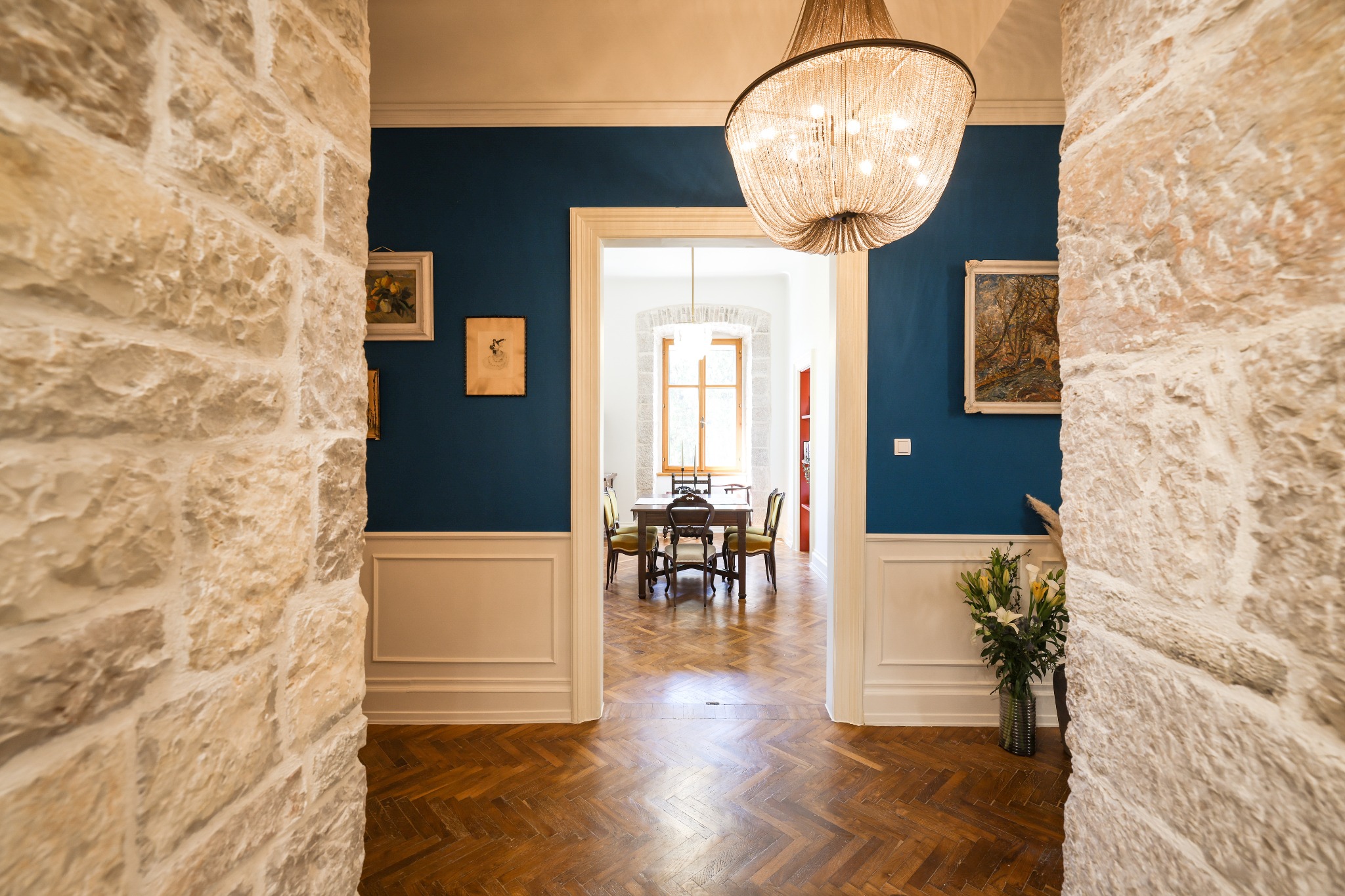 Historic stone walls framing the dining room at The Zadar Residence