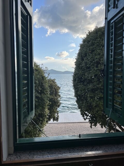 The Adriatic Sea seen through the open shutters of The Zadar Residence